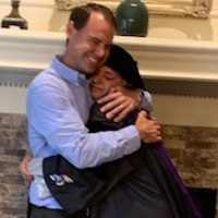 William Denning hugging his daughter after her graduation.