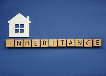 Word Inheritance made with wooden cubes and house model