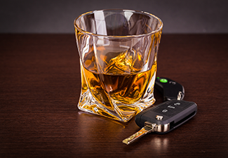 Car keys and alcoholic drink