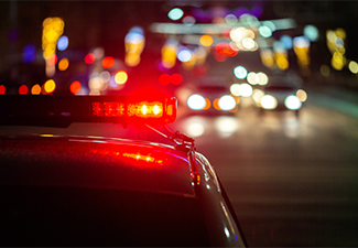 Police Car Lights in Night City with Selective Focus