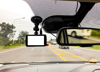 Black digital dashcam installed in the car