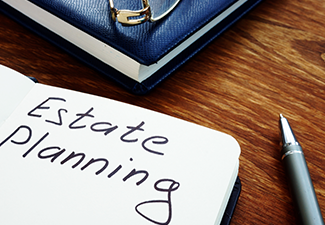 Estate planning handwriting sign on the sheet