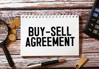 Text Buy-Sell Agreement on white paper