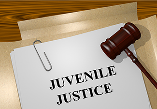 Juvenile Justice concept with gavel on table