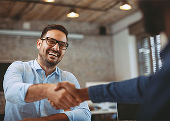 Businessman smiling and shaking hands