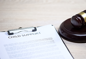 Child support document table, gavel lying on sound block