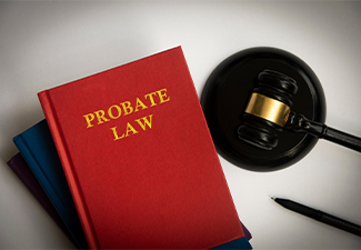 Top view of probate law book with gavel on white background