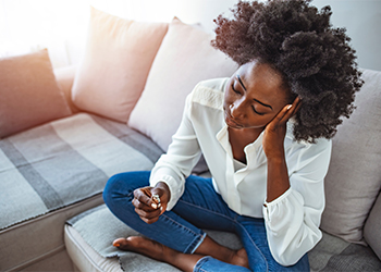 Women taking off wedding ring considering divorce