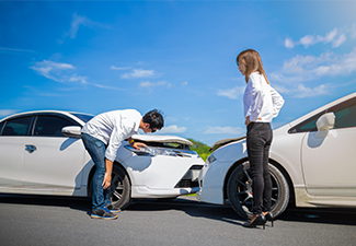 Two Drivers arguing on road after a car accident