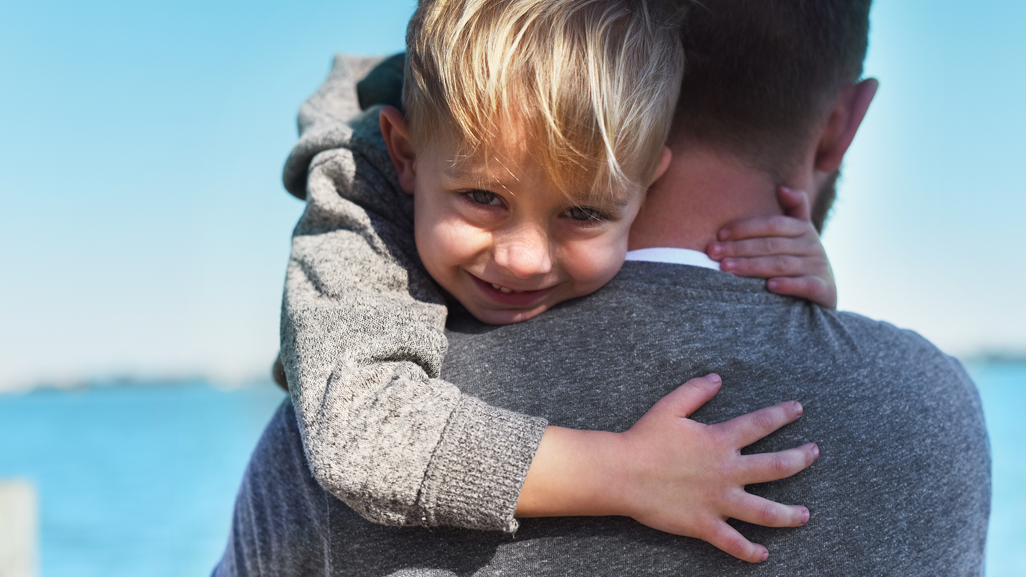 A son holding on to his dad.