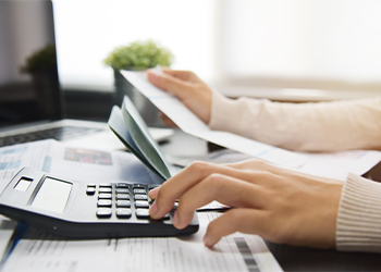 Woman calculating her Debt