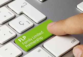 Man oressing key with FLP Family Limited Partnership