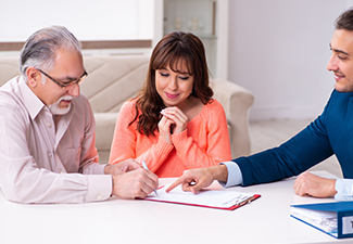 Young male lawyer, old man and his granddaughter in testament