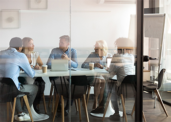 Employees inside meeting room