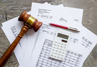 Judge hammer near financial documents on grey background top view