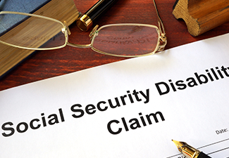 Social security disability claim on a wooden table