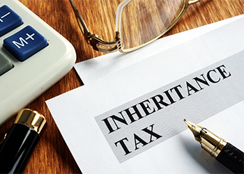 Inheritance tax application form, pen and calculator