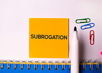 Subrogation word written on sticky note
