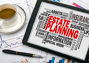 Estate planning with related word cloud on tablet