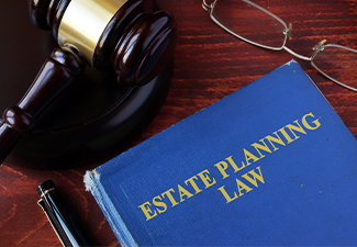 Book with title estate planning law and a gavel
