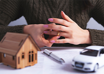 Women removing wedding ring from hand