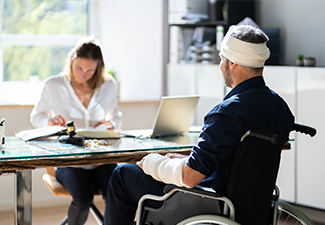 Injured Worker Discussing Compensation Money And Litigation with Lawyer