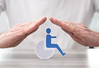 Man's hand protecting disable person model
