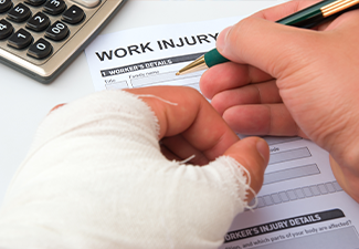 Injured worker filling up a work injury claim form