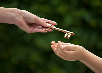 Adult Handing Key to Young, Inheritance Concept