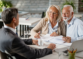 Couple consulting with attorney at his office