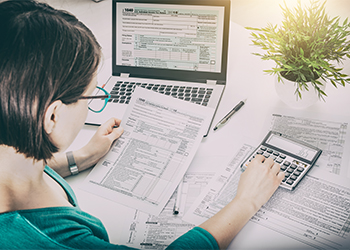 Women calculating Tax