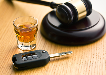 Car Keys, Glass of Alcohol and Gavel