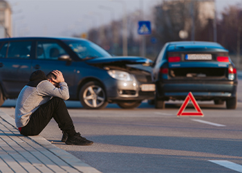 Sad man after car accident