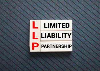 Wooden blocks with words LLP: Limited Liability Partnership