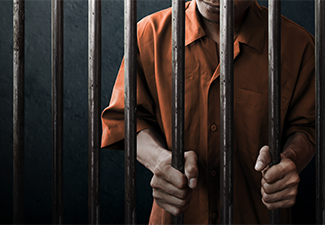 Person in Prison Cell