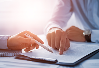 Businessman and Lawyer Discussing a Contract.