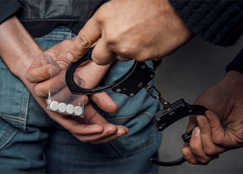 Police arresting man in drug charges