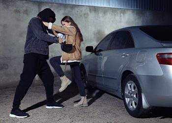 Woman defending herself from attacker on parking lot