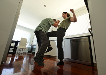 Women defending against intruder in home