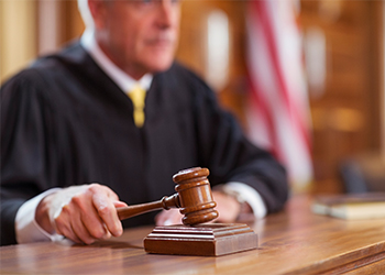 Judge banging gavel in court