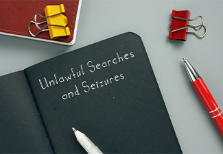 Unlawful Searches and Seizures sign on the page