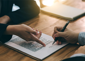 Man signing agreement contract with Employer