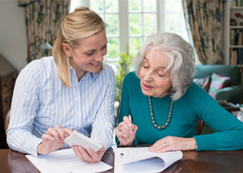 Senior women preparing estate plan with help of attorney