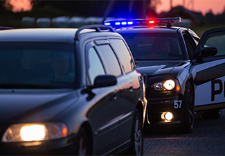Highway Traffic Patrol Car Pulls over Vehicle on the Road