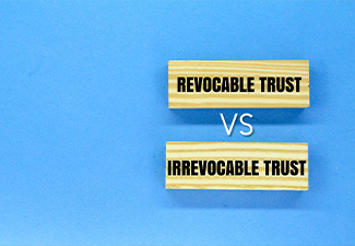 Wooden arrangement with the words Irrevocable Trust vs Revocable Trust