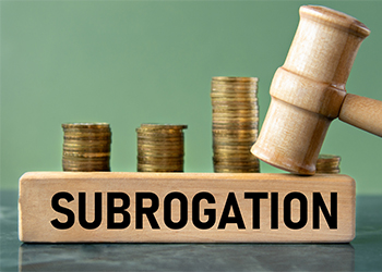 SUBROGATION word with judge's gavel and stack of coins 