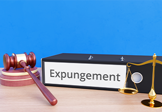 Expungement – Folder with labeling, gavel and libra – law, judgement, lawyer