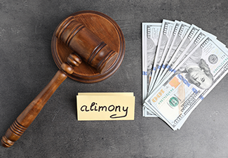 Card with word Alimony, dollar banknotes and wooden gavel on grey table