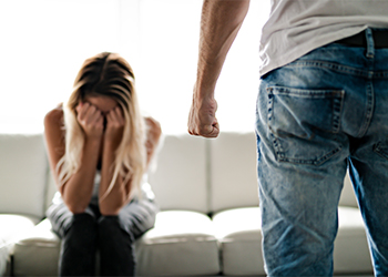 Man beating up his wife illustrating domestic violence