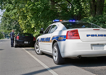 Police pulling over car for speeding